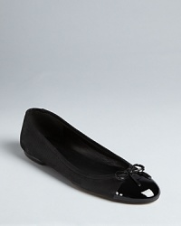 Pure elegance, these Delman ballet flats marry classic styling with polished, patent cap toe details.