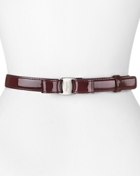 With it's slick patent leather and feminine bow detailing, Salvatore Ferragamo's leather belt lends every look polished sophistication.