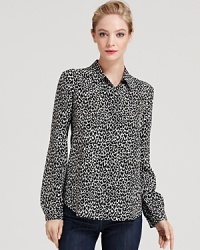 Our obsession with bold animal prints continues with this chic leopard-printed Theory top, rendered in pure silk.