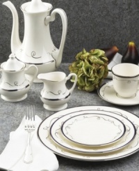 Set the table with charm and delight with the Infinity collection form Pickard. This graceful pattern features midnight blue bands framed by platinum and accented further by a whimsical, free-flowing, platinum ribbon. Round vegetable bowl not shown.