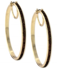 Hit the right notes with these hoop earrings from Jessica Simpson. Crafted from gold tone mixed metal, they also shine with a topaz-colored glitter. Approximate drop: 2-1/2 inches. Approximate diameter: 2-1/2 inches.