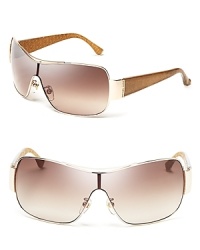 Rock the hottest silhouette to hit the runways in MICHAEL Michael Kors' sporty-chic shield sunglasses.