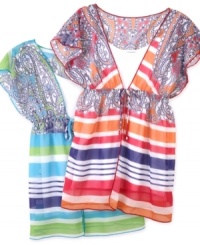 Free flowing. Pretty prints accent this fun, fluid tunic from BCX. (Clearance)