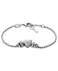 Fossil shows its heart is in the right place with this bracelet. Crafted from polished stainless steel, a clear glass crystal heart stands at the center, offset by beads for a nice touch. Approximate length: 6-3/4 inches + 3/4-inch extender.