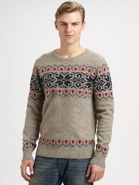 A soft, sumptuous wool blend is knitted in a playful and colorful Fair Isle pattern for traditional seasonal style.CrewneckRibbed knit collar, cuffs and hem80% wool/20% nylonDry cleanImported