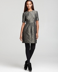 This Burberry London textured dress can be easily dressed up or down. Wear it to work with tights and simple jewelry, or glam it up for the evening with a statement necklace, heels and bold red lips.