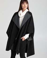 Modern, sophisticated and cool, this voluminous Vince cape delivers laid-back luxury.