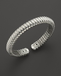 Slim, flexible sterling silver forms a stunning bracelet. From the John Hardy Bedeg Collection.