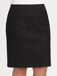 At first glance, it seems like a classic woven skirt, until you look closer at its rich, snakeskin texture.Wide smooth waistband with back V shaping and elastic insetSide zip closureSeamed detailZip-close center back ventFully linedKnee lengthPolyesterDry cleanImported