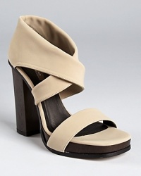 Stretchy matte fabric makes a modern-minimalist statement on Calvin Klein Collection's Fiana sandals.