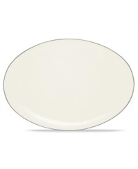 Simple and versatile, the Colorwave Green oval platter is crafted in white stoneware with forest green accents. Mix and match this mealtime essential with dinnerware in coupe and quad shapes to create a table that's an expression of your personal taste.