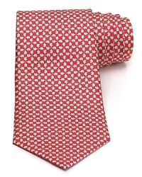 A silk tie adds distinction and flair to your formal presentation. With a repeating pattern of elephants, you'll also punch up your attire with a bit of wit.