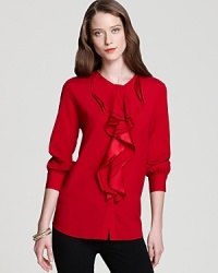 A cascade of rolling ruffles infuses a silk-blend DKNY blouse with effortless romantic spirit.