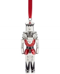 A classic symbol of Christmas re-purposed for your tree, the Lenox nutcracker ornament glistens in polished silver plate with sparkling rhinestone and holiday-red accents.