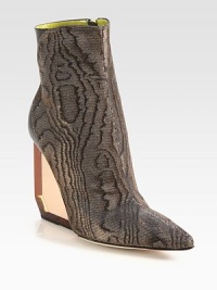 A translucent lucite wedge modernizes this pumped-up ankle boot in metallic brocade and soft leather. Lucite wedge, 4 (100mm)Metallic brocade and leather upperPoint toeSide zipLeather lining and solePadded insoleMade in Italy