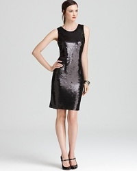 Dripping with decadent sequins, this Calvin Klein dress lends liquid-like dimension to your cocktail look. Amp up the shine factor with sleek silver accents.