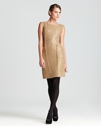 Embark on a fashion trip in a metallic MICHAEL Michael Kors sheath dress, finished with frayed seaming for a touch of tribal chic.