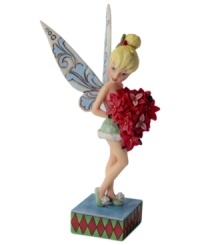 Clap your hands! Holding a bright batch of poinsettias, Tinkerbell makes an unforgettable Christmas debut. This precious fairy flutters airy wings that are emblazoned with a delicate, floral-inspired design.