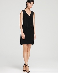 A subtle ruffle lends movement to this modern Tibi dress in a stunningly simple silhouette. Pair with sleek heels for minimalist chic.