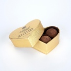 Lightly dusted milk chocolate truffles with a Marc de Champagne center.