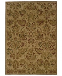 A soft, beige ground is covered in beautiful shades of brown and red on this delightful rug from Sphinx. Perfect in any bedroom, dining room or living room, this tradiotional-style piece is woven from durable nylon fibers.