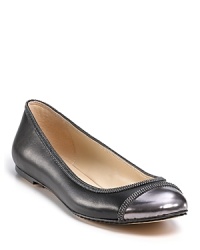 Gleaming and glittering, these chain-decked flats feature a metallic captoe and loads of attitude. By KORS Michael Kors.