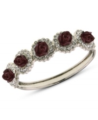 A beautiful bouquet, right at your wrist. This bangle bracelet from 2028 is crafted from silver-tone mixed metal with glass crystals surrounding cranberry-colored flower details. Approximate length: 6-1/2 inches.