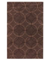 Interlocking circles create a lush geometric pattern that help shape any room on this rich brown area rug from Surya. Hand-tufted from poly-acrylic fibers that provide luxurious softness without shedding, this rug adds a striking, easy-maintenance accent to any living space.