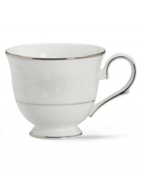 Pure opulence. Posh opalescence. This classically designed line of Lenox dinnerware and dishes is accented by a platinum rim and a delicate flourish of vine-like, white-on-white imprints with raised, iridescent enamel dots. Great gift for housewarming, wedding or yourself. Teacup shown left.