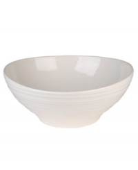 Evoking the natural exuberance of thrown pottery, the Mikasa Swirl vegetable bowl brings unfussy elegance to your table in classic stoneware. Vegetable bowl not shown.