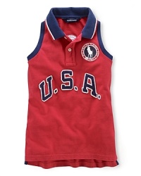 A red, white and blue design with U.S.A. patching and embroidered emblems gives a preppy, all-American look to the classic sleeveless polo, celebrating Team USA's participation in the 2012 Olympics.