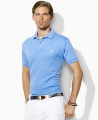 A classic short-sleeved polo shirt is cut for a relaxed, comfortable fit in smooth, soft cotton interlock.