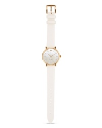 Take a classic approach to accessorizing with this leather strap watch from kate spade new york. With a gold-plated case and Mother-of-Pear dial, it's a timeless choice.