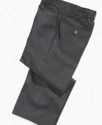 Comfortable and classically stylish. He'll be dressed to impress with these dress slacks by Calvin Klein.