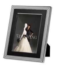 Add new elegance to beautiful memories with Vera Wang's With Love Noir picture frame. Geometric detail lends metallic shimmer to chic black enamel in a home accent that invokes modern and deco design.