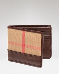 Each side of this unique wallet boasts a different take on the signature check pattern, a modern design for all your daily essentials from the always urbane Burberry.