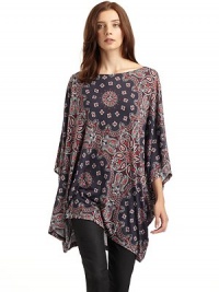 THE LOOKBateau necklinePullover styleCape style dolman sleeves Paisley printAsymmetrical hemTHE FITAbout 34 from shoulder to longest point of hemTHE MATERIALModalCARE & ORIGINMachine washImported