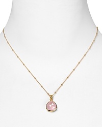 This haute bohemian pendant necklace from Coralia Leets charms with rich texture and hue. The gleaming gold setting sets off a rose quartz stone.