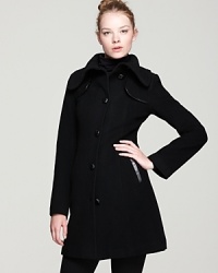 Woven leather-wrapped buttons and leather-trimmed shoulder detailing bring subtle gloss to this elegantly timeless Mackage pea coat.