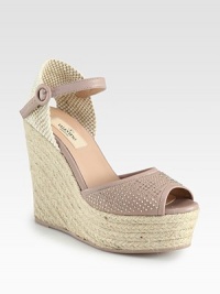 Backed by soft woven canvas, this heightened espadrille silhouette has a leather upper with glistening metal studs. Covered wedge, 5 (125mm)Covered platform, 1¾ (45mm)Compares to a 3¼ heel (80mm)Woven canvas and leather upper with metal studsAdjustable leather ankle strapLeather liningRubber trek solePadded insoleMade in Italy