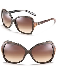 Glam it up in oversized square sunglasses with snake printed trim along top and sides.