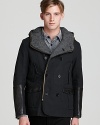 A smart mix of refined and sporty, this handsome coat features sleek leather details and unique pocket detailing to set your outdoor look apart.