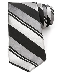 Wide bar stripes are augmented neatly with thinner tonal bands, creating a dynamic pattern on this pure Italian silk tie from Valentino, a distinguished offering for your fine collection.