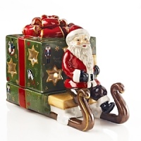 Nostalgic and sweet, this charming Santa votive is ready to make a special delivery.