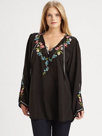 Embroidered flowers adorn this flowing top with self ties at its decolletage-flattering neckline. Ties at split neckPull-on styleEmbroidered detailsPull-on styleCurved hemAbout 32 from shoulder to hemRayonMachine washImported