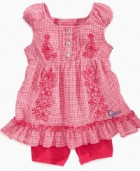 It's in the details. Sweet embroidery and ruffles add whimsy to your little lady's closet with this tunic and short set from Guess.