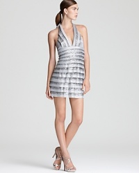 Tiers of sequins and satin lend a shimmering look to BCBGMAXAZRIA's showstopping halter dress.