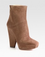 Suede ankle boot with geometric heel and hidden platform. Suede-covered heel, 5½ (140mm)Hidden platform, 1½ (40mm)Compares to a 4 heel (100mm)Suede upperBack zipLeather liningLeather and rubber solePadded insoleMade in Italy