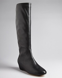 Set on delicate, covered demi wedges, these tall black boots are the height of sleek; by Ted Baker.