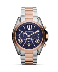 Adapt a bold approach to accessorizing with this two-tone watch from Michael Kors. The oversized bezel makes this piece stand out, so wear it to set off day-to-day looks.